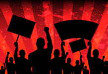 Red Therapy. Lo personal es político Siluetas de una multitud, levantando los puños y agitando pancartas en señal de protesta, con el fondo de la imagen en franjas rojas.